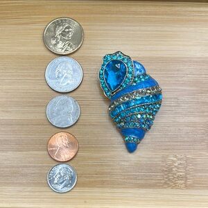 Blue and Silver Shell Brooch Rhinestones 1 1/2 inches wide by 2 1/2 inches tall